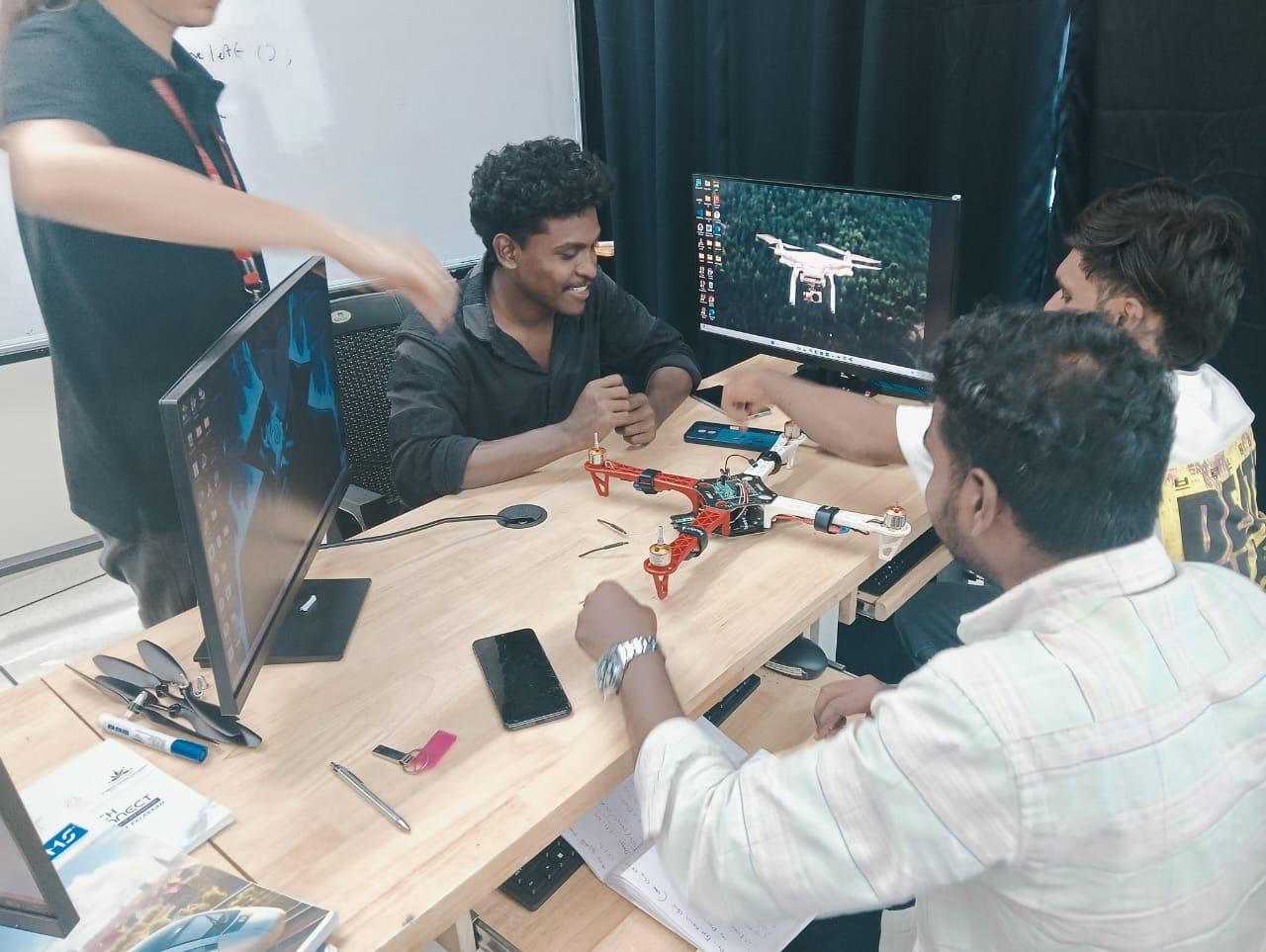 Participants assembling a robot during a workshop at TIH, IIT Palakkad